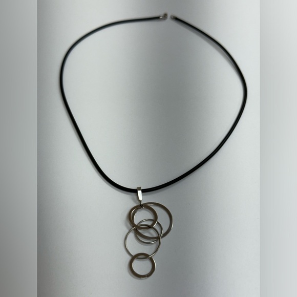 14k stamped white gold geometric pendant on a black rubber cord, gold clasp. - Picture 3 of 6